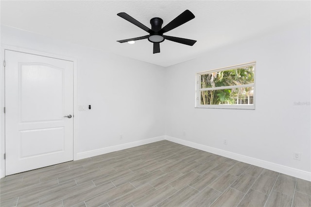 10055 Franklin Dr, Englewood, FL 34224 - spare room featuring a ceiling fan, baseboards, and light wood finished floors