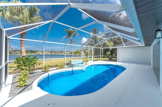 10055 Franklin Dr, Englewood, FL 34224 - view of swimming pool featuring a water view, a pool with connected hot tub, glass enclosure, and a patio area