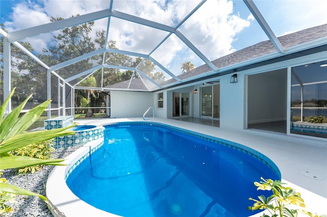 10055 Franklin Dr, Englewood, FL 34224 - view of pool featuring a patio area, a pool with connected hot tub, and glass enclosure