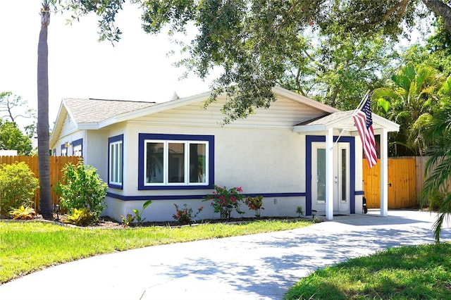 204 36th St W, Bradenton, FL 34205 - view of front of property featuring roof with shingles and stucco siding
