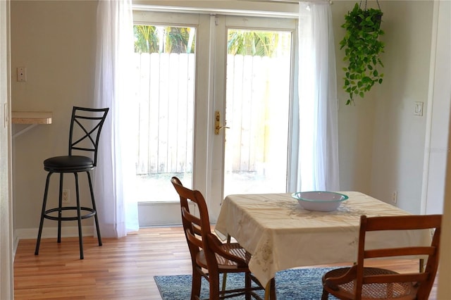 204 36th St W, Bradenton, FL 34205 - dining room featuring light wood-style flooring and baseboards