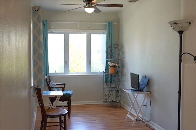 204 36th St W, Bradenton, FL 34205 - living area with a ceiling fan, wood finished floors, and baseboards