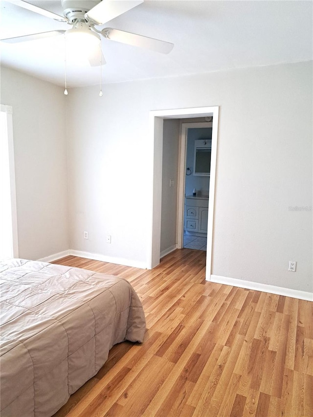 204 36th St W, Bradenton, FL 34205 - bedroom with baseboards, light wood finished floors, and a ceiling fan