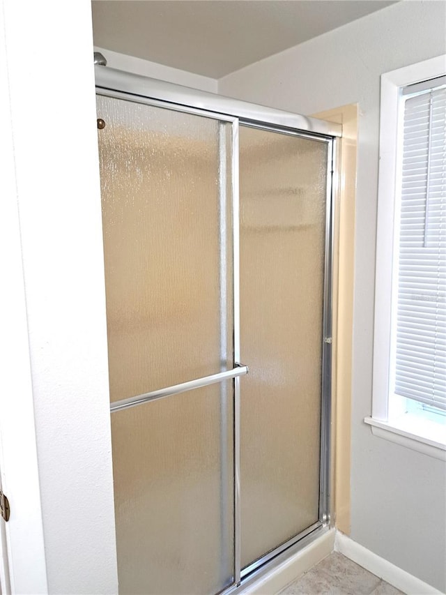 204 36th St W, Bradenton, FL 34205 - full bathroom with a shower with door and baseboards