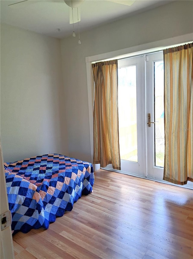 204 36th St W, Bradenton, FL 34205 - bedroom featuring multiple windows, wood finished floors, and access to outside