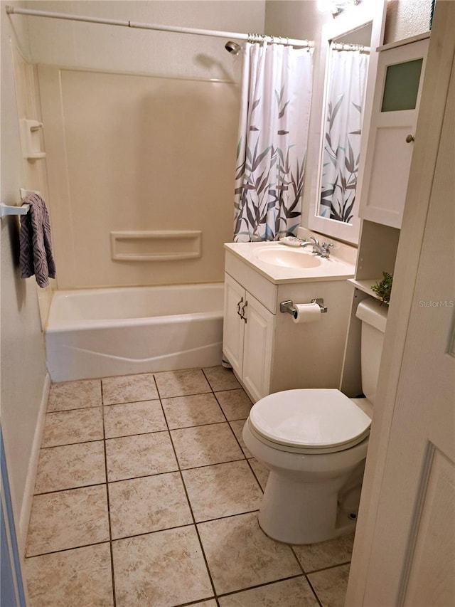 204 36th St W, Bradenton, FL 34205 - bathroom featuring toilet, vanity, shower / bath combo with shower curtain, and tile patterned floors