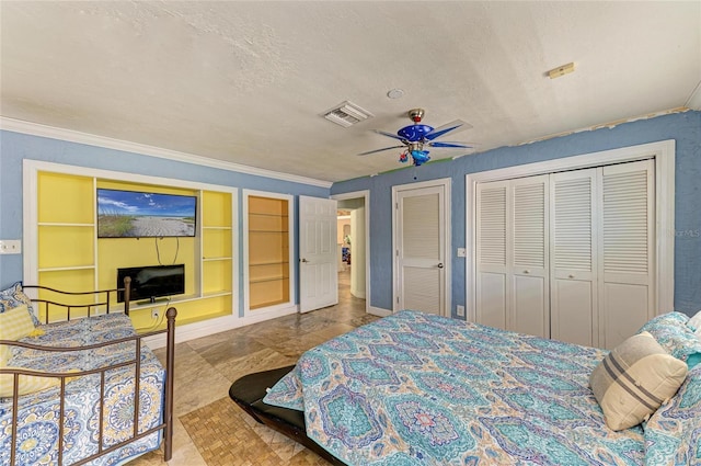 2726 Desoto Rd, Sarasota, FL 34234 - bedroom with crown molding, two closets, ceiling fan, and a textured ceiling