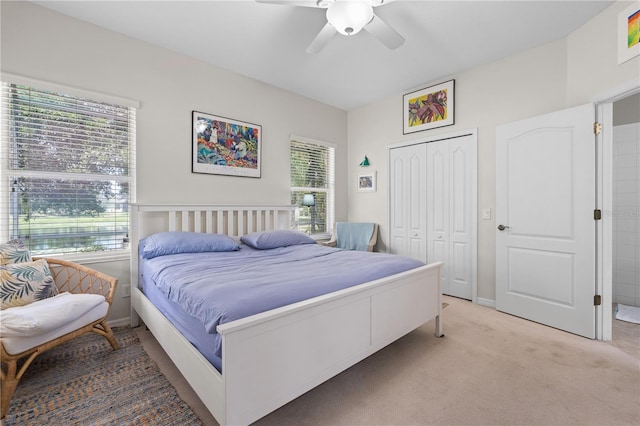 5047 Newport News Cir, Bradenton, FL 34211 - bedroom with a closet, light colored carpet, and a ceiling fan