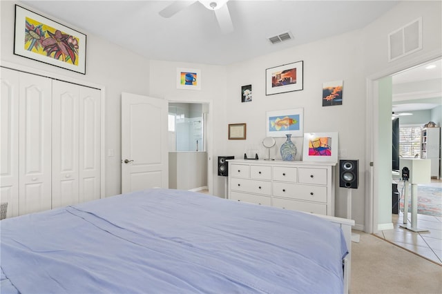 5047 Newport News Cir, Bradenton, FL 34211 - bedroom with light colored carpet, ceiling fan, a closet, and baseboards