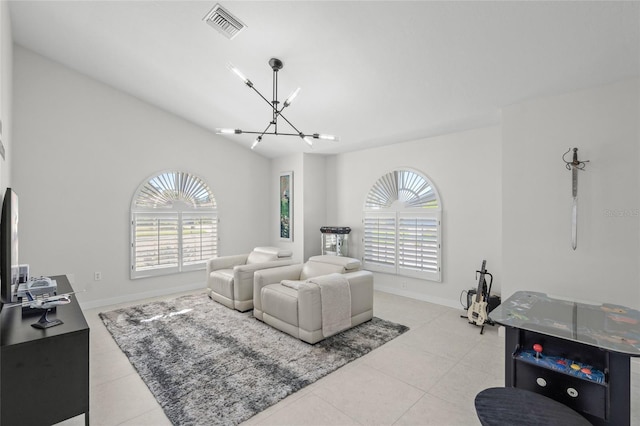 1527 Buoy Ln, Osprey, FL 34229 - living room with a chandelier, light tile patterned floors, and baseboards