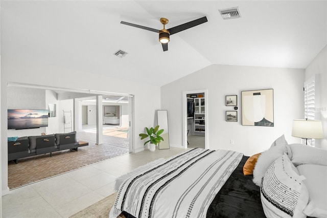 1527 Buoy Ln, Osprey, FL 34229 - bedroom featuring lofted ceiling, a spacious closet, tile patterned floors, and a ceiling fan