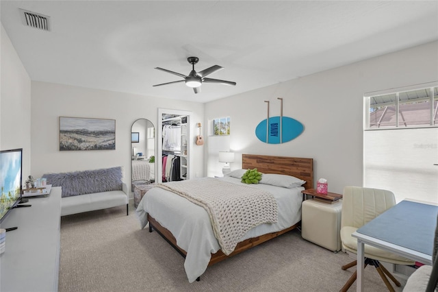 1527 Buoy Ln, Osprey, FL 34229 - bedroom featuring carpet floors, a closet, a ceiling fan, and a walk in closet