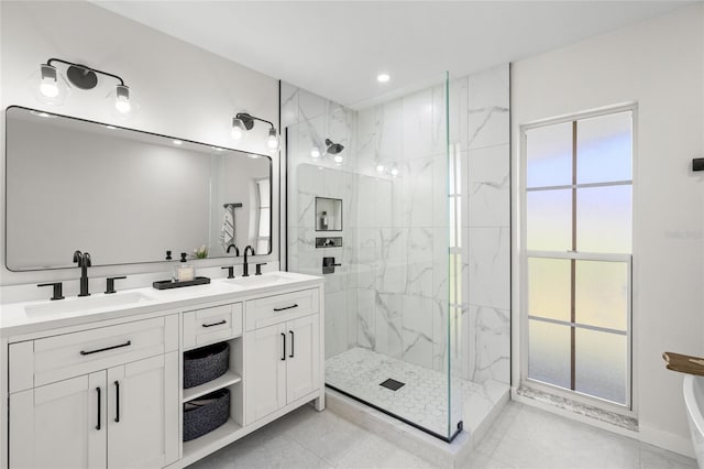 1527 Buoy Ln, Osprey, FL 34229 - bathroom with a marble finish shower, double vanity, tile patterned flooring, and recessed lighting