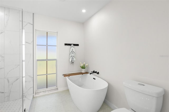 1527 Buoy Ln, Osprey, FL 34229 - full bathroom with a soaking tub, a marble finish shower, toilet, baseboards, and recessed lighting