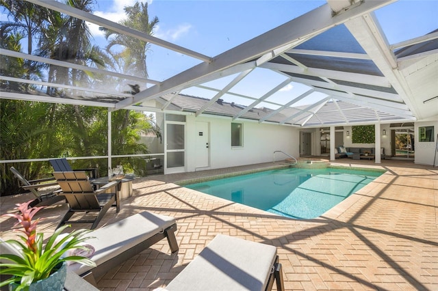 1527 Buoy Ln, Osprey, FL 34229 - view of pool featuring a patio area, a lanai, outdoor lounge area, and a pool with connected hot tub
