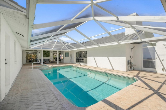 1527 Buoy Ln, Osprey, FL 34229 - swimming pool with a patio, glass enclosure, and an outdoor living space