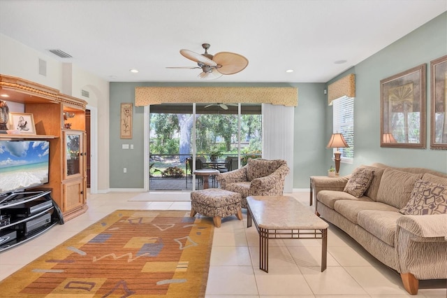4121 Reflections Pkwy, Sarasota, FL 34233 - living room with light tile patterned floors, ceiling fan, healthy amount of natural light, recessed lighting, and baseboards