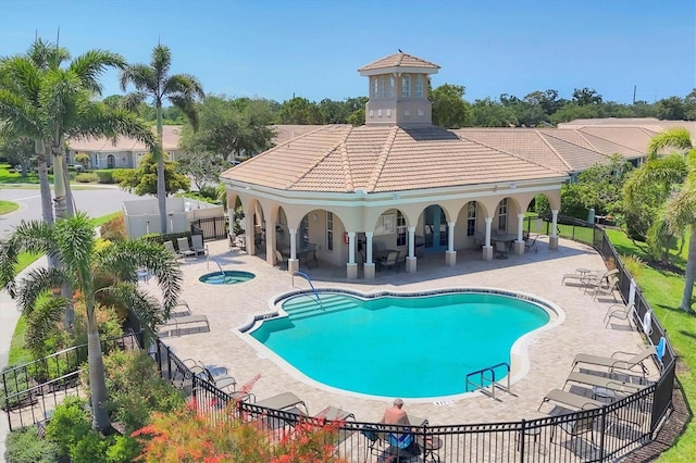 4121 Reflections Pkwy, Sarasota, FL 34233 - community pool with a patio area and a hot tub