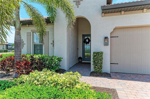 501 Maraviya Blvd, Nokomis, FL 34275 - property entrance with stucco siding and a garage