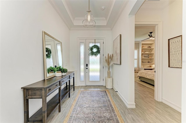 501 Maraviya Blvd, Nokomis, FL 34275 - foyer entrance featuring light wood-style floors, baseboards, and ornamental molding