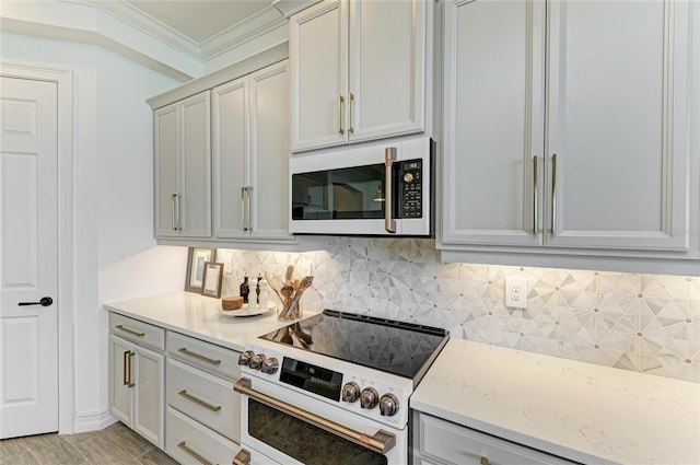 501 Maraviya Blvd, Nokomis, FL 34275 - kitchen featuring white electric stove, backsplash, and ornamental molding