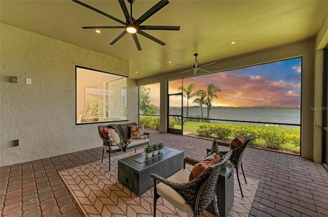 501 Maraviya Blvd, Nokomis, FL 34275 - sunroom with a ceiling fan, a water view, and healthy amount of natural light