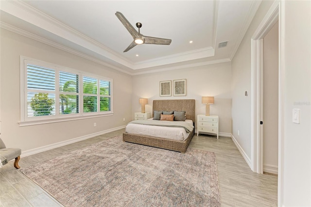 501 Maraviya Blvd, Nokomis, FL 34275 - bedroom featuring a raised ceiling, light wood-style floors, crown molding, baseboards, and ceiling fan