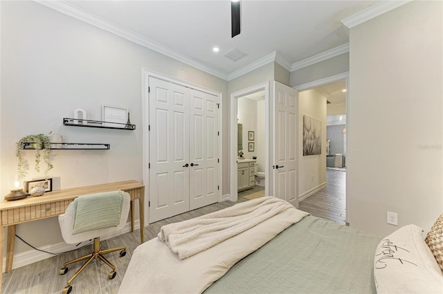 501 Maraviya Blvd, Nokomis, FL 34275 - bedroom featuring wood finished floors, a closet, a desk, ornamental molding, and recessed lighting
