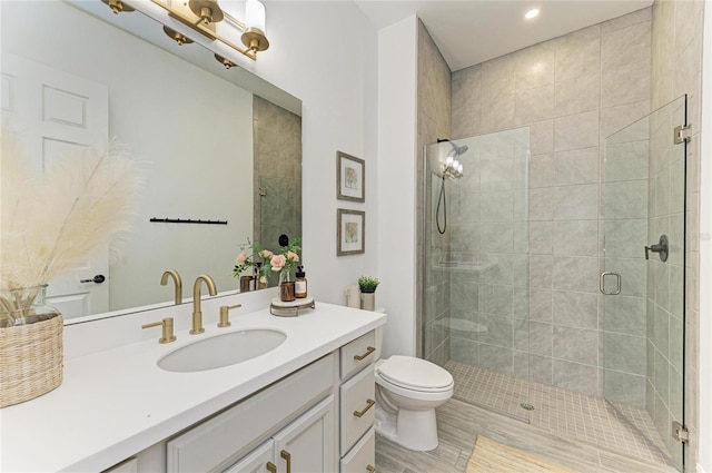 501 Maraviya Blvd, Nokomis, FL 34275 - bathroom with vanity, a shower stall, toilet, and recessed lighting