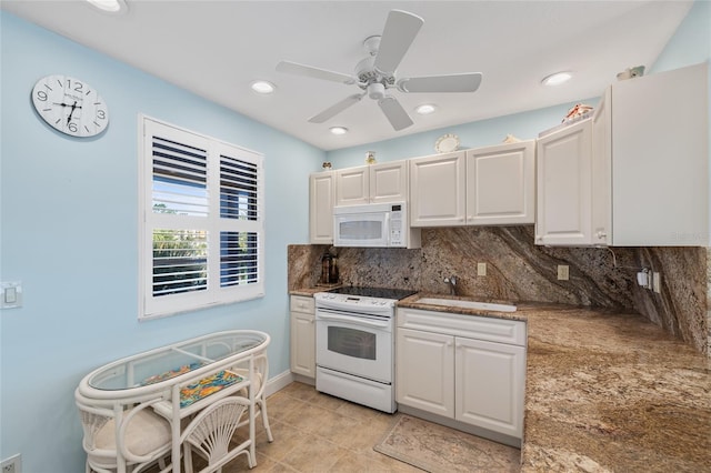 4310 Falmouth Dr Unit 307, Longboat Key, FL 34228 - kitchen with white appliances, a sink, backsplash, white cabinets, and ceiling fan