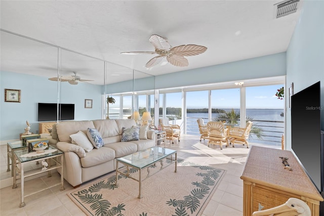 4310 Falmouth Dr Unit 307, Longboat Key, FL 34228 - tiled living area featuring ceiling fan