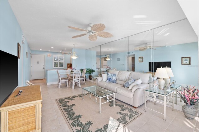 4310 Falmouth Dr Unit 307, Longboat Key, FL 34228 - tiled living room featuring ceiling fan