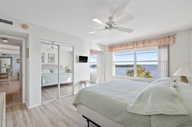4310 Falmouth Dr Unit 307, Longboat Key, FL 34228 - bedroom with light wood-type flooring, a closet, ceiling fan, and baseboards