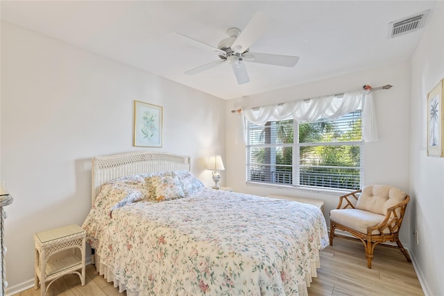 4310 Falmouth Dr Unit 307, Longboat Key, FL 34228 - bedroom with light wood-type flooring, baseboards, and ceiling fan
