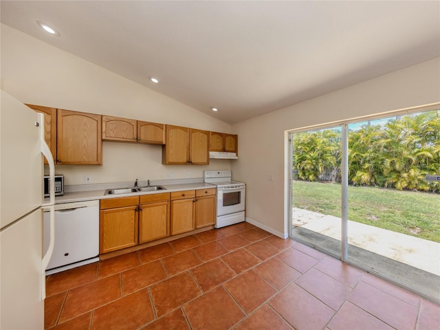 3698 N Chamberlain Blvd, North Port, FL 34286 - kitchen with white appliances, a sink, under cabinet range hood, light countertops, and lofted ceiling