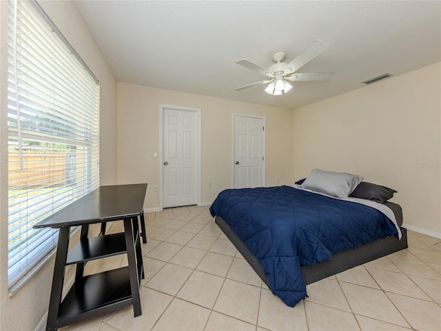 3698 N Chamberlain Blvd, North Port, FL 34286 - bedroom featuring light tile patterned floors, baseboards, and a ceiling fan