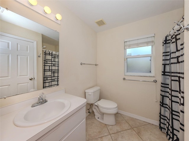 3698 N Chamberlain Blvd, North Port, FL 34286 - bathroom featuring vanity, toilet, tile patterned floors, and baseboards