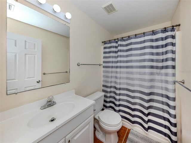 3698 N Chamberlain Blvd, North Port, FL 34286 - bathroom featuring toilet, vanity, and a shower with curtain