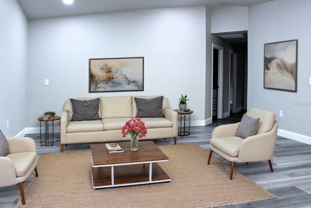 27944 Green Willow Run, Wesley Chapel, FL 33544 - living room with baseboards and wood finished floors