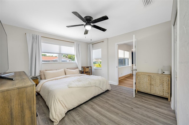 440 42nd St N, Saint Petersburg, FL 33713 - bedroom featuring light wood-type flooring, ceiling fan, and baseboards