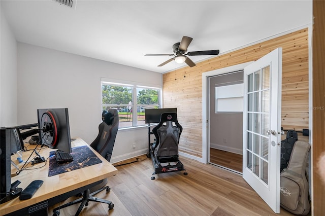 440 42nd St N, Saint Petersburg, FL 33713 - office space with wooden walls, a ceiling fan, wood finished floors, baseboards, and french doors