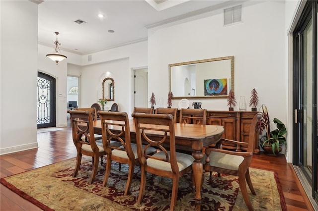 4696 Del Sol Blvd, Sarasota, FL 34243 - dining area featuring crown molding, wood finished floors, and recessed lighting
