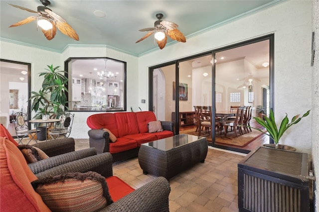 4696 Del Sol Blvd, Sarasota, FL 34243 - living room with ceiling fan, a chandelier, and ornamental molding