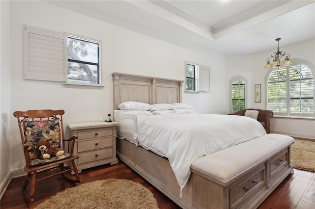 4696 Del Sol Blvd, Sarasota, FL 34243 - bedroom featuring a tray ceiling, dark wood-type flooring, ornamental molding, a chandelier, and arched walkways