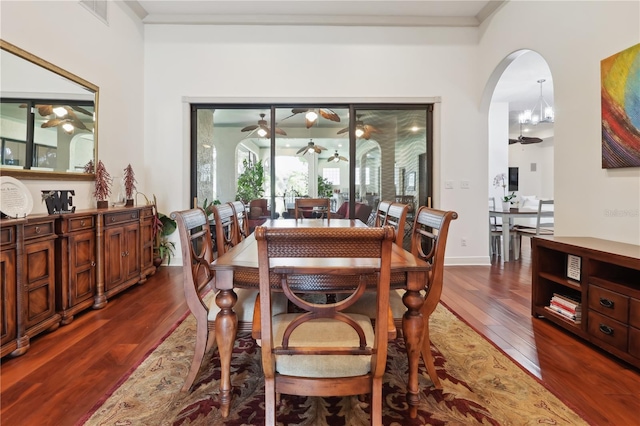 4696 Del Sol Blvd, Sarasota, FL 34243 - dining room with ceiling fan, dark wood-type flooring, and arched walkways