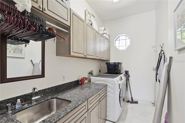 4696 Del Sol Blvd, Sarasota, FL 34243 - laundry room with cabinet space, washer and clothes dryer, light marble finish floors, and baseboards