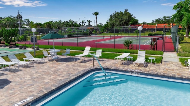 1409 57th St W Unit 1409, Bradenton, FL 34209 - view of swimming pool with a tennis court