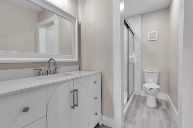 1409 57th St W Unit 1409, Bradenton, FL 34209 - full bathroom with vanity, a shower stall, and wood finished floors