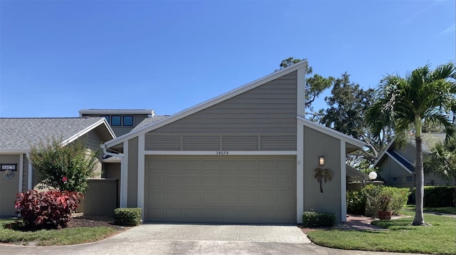 3407 Avenida Madera Unit A, Bradenton, FL 34210 - view of front facade with an attached garage and concrete driveway
