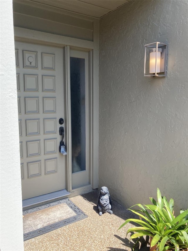3407 Avenida Madera Unit A, Bradenton, FL 34210 - view of exterior entry featuring stucco siding